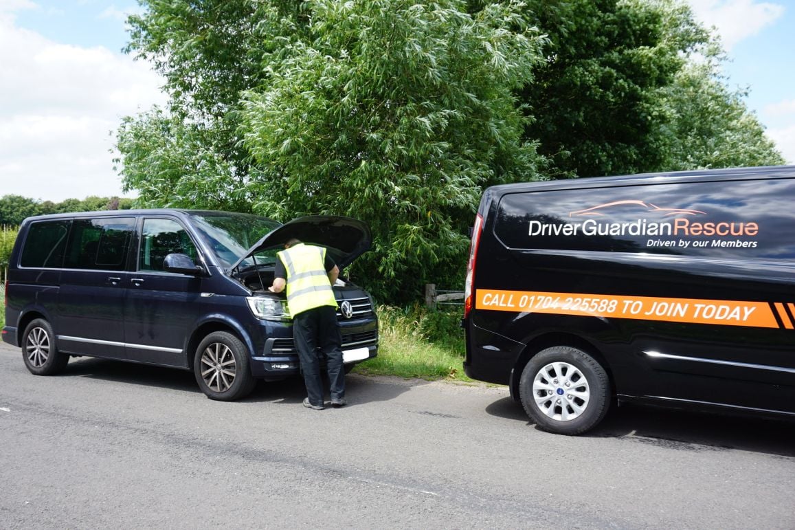 A Driver Guardian Agent Fixing A Camper Van